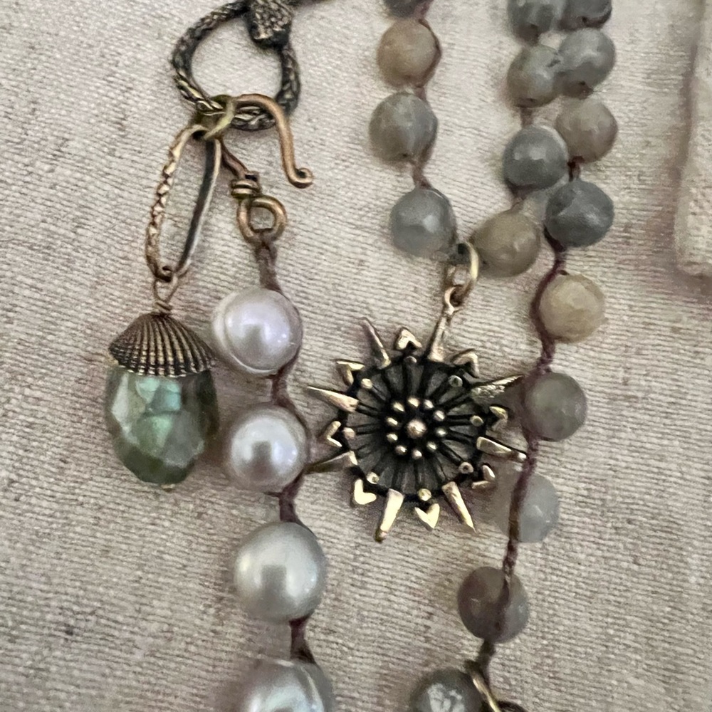 Hand made necklace with natural beading and gems.